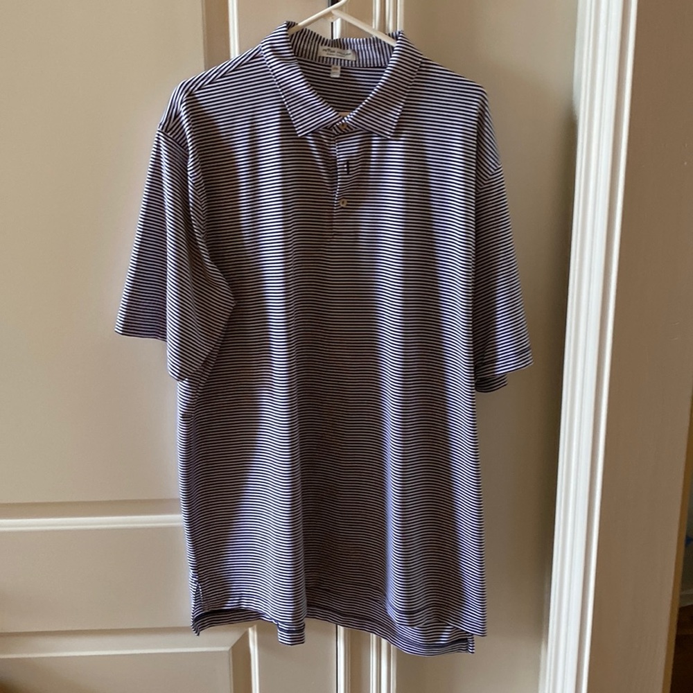 Peter Millarwith blue bird logo on sleeve